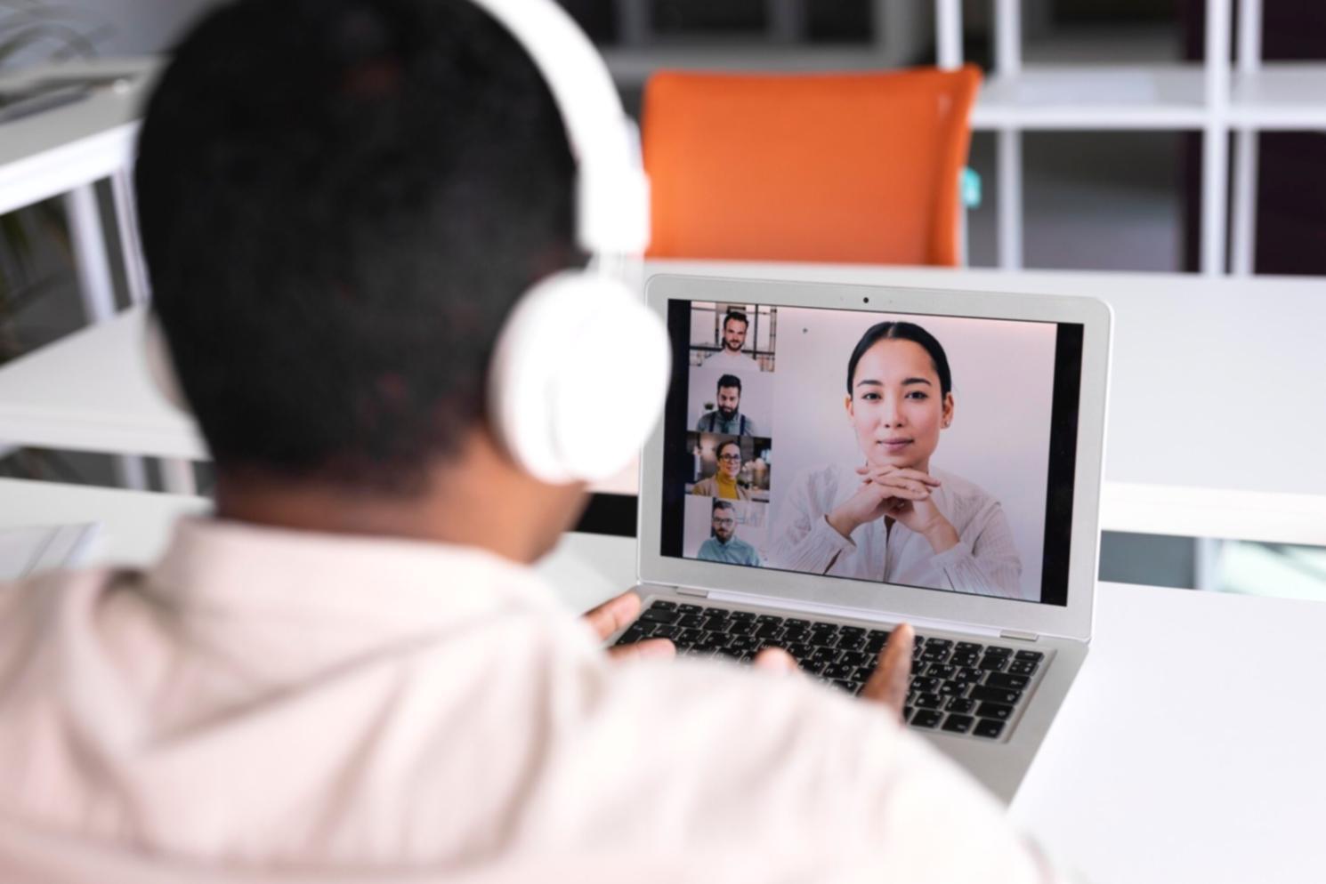 Business professional reviewing organised financial records on modern workspace with documents and digital tools